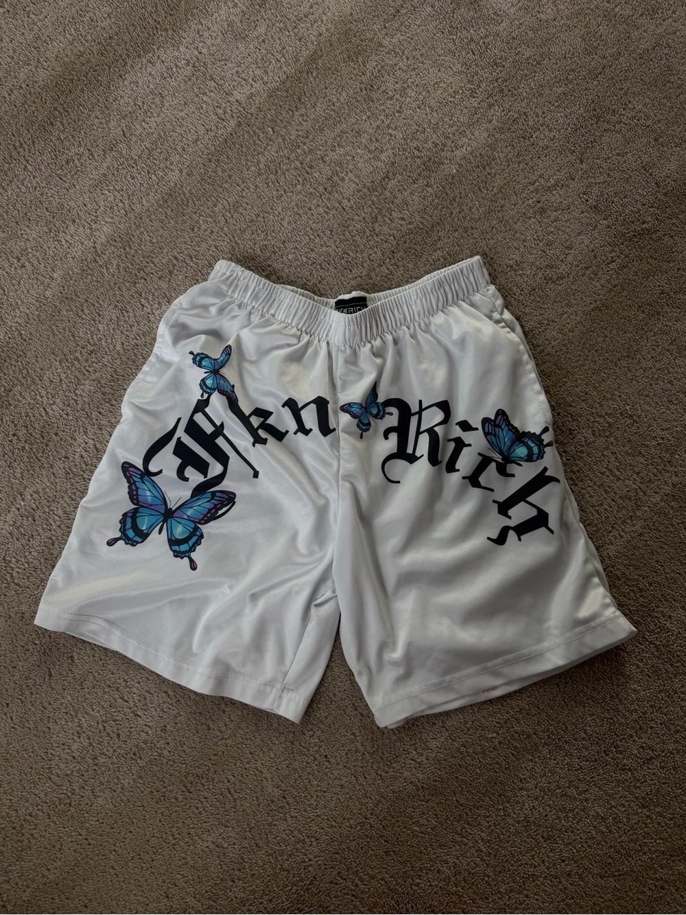 White Athletic Shorts with Blue Butterfly Graphic